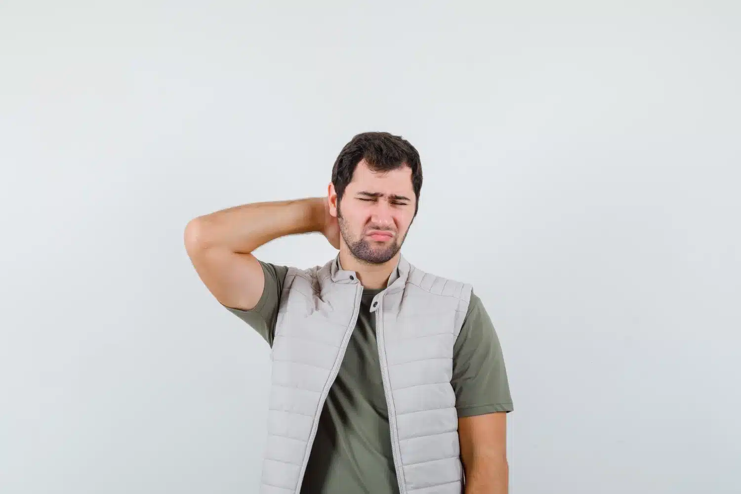 Person feeling neck pain related to shoulder tension headache