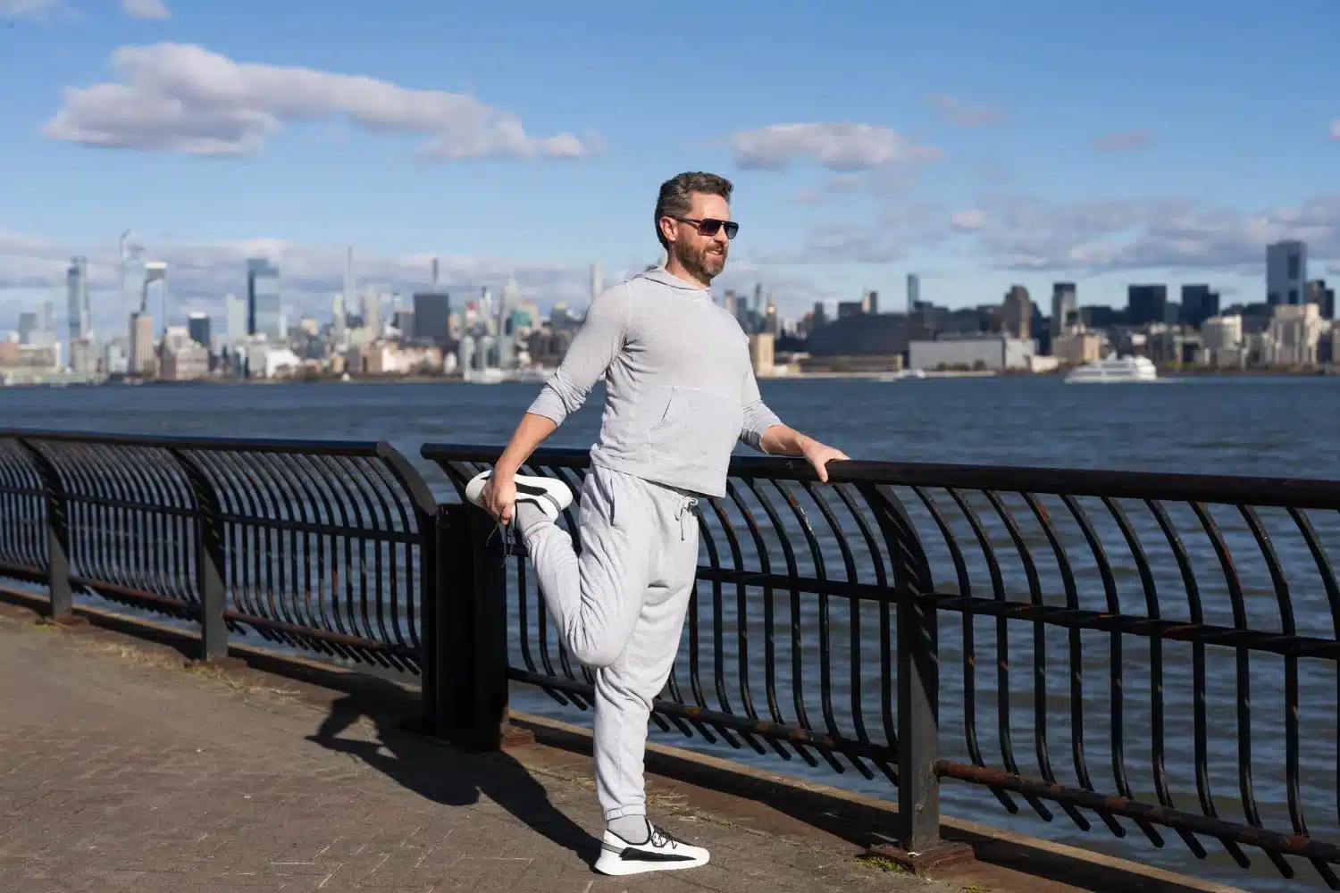 Man doing gentle stretch to ease sciatica pain after long car journey