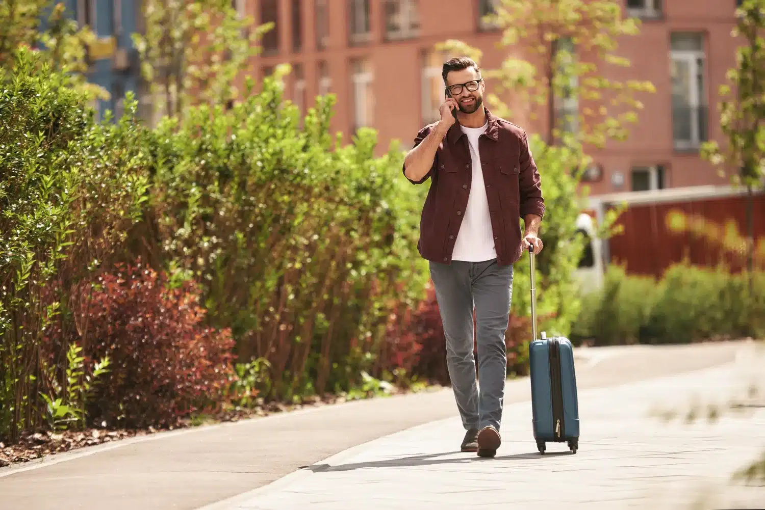 Person walking carefully due to sciatica pain after a long drive
