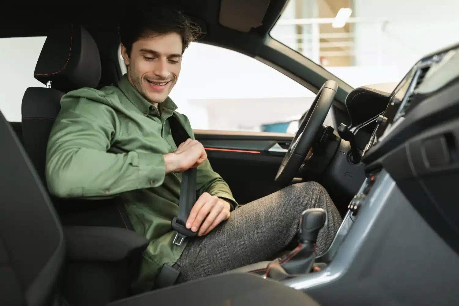 Man adjusting seat position to reduce sciatica pain during a long drive