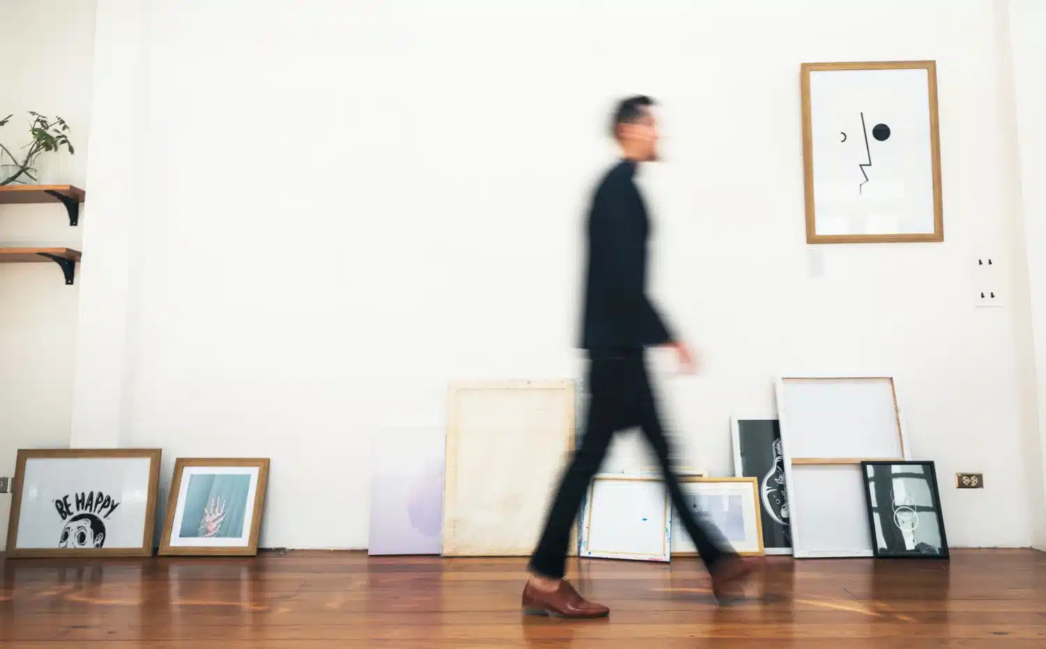 Person walking around home office to reduce back pain from sitting