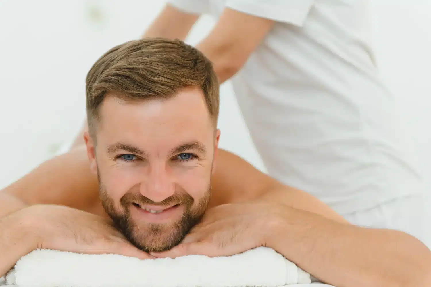 Man enjoying Swedish massage session for stress relief
