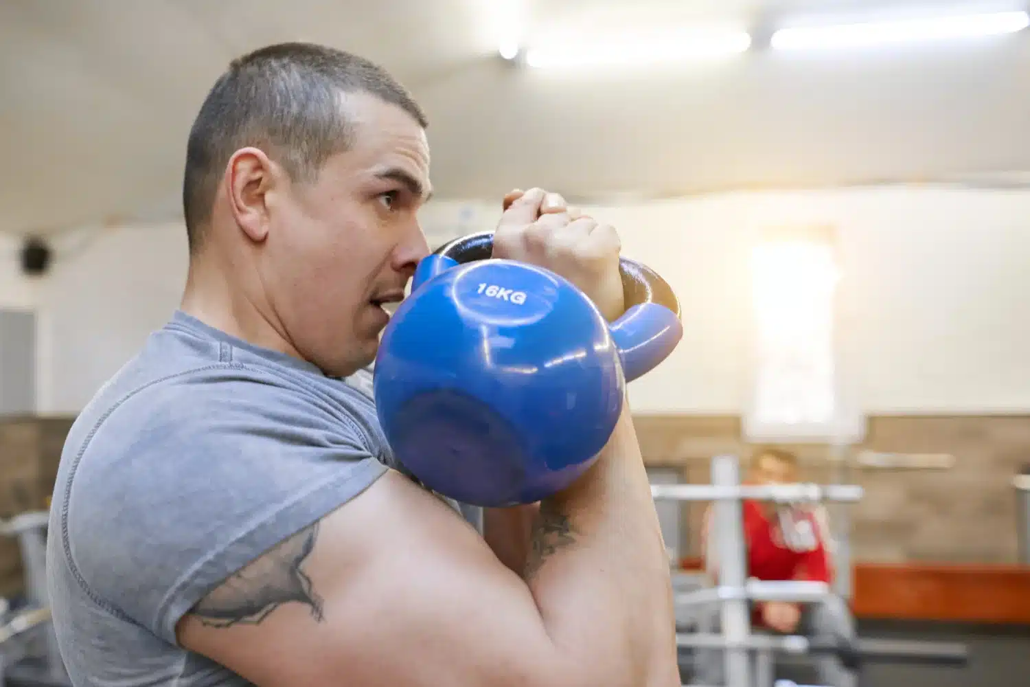 weightlifter training with kettlebell before muscle recove